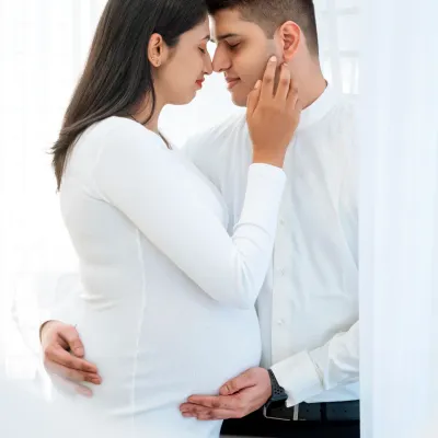 An intimate black and white portrait of a couple, lost in their own world. This simple, clean studio look puts all the focus on the emotion and connection.