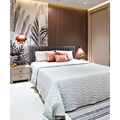 This master bedroom combines a dramatic monochrome wallpaper with a rich brown paneled accent wall. Rose gold pendant lights and metal inlays add a touch of glamour, while the cozy textiles create an inviting atmosphere.