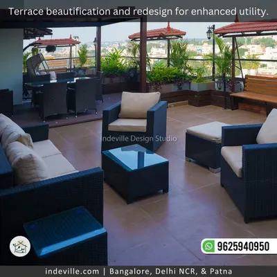 This redesigned terrace is all about enhanced utility and comfort. I've zoned the space with weatherproof wicker lounge furniture, a shaded swing bench, and lush planters to create the perfect outdoor escape for relaxation and socializing.