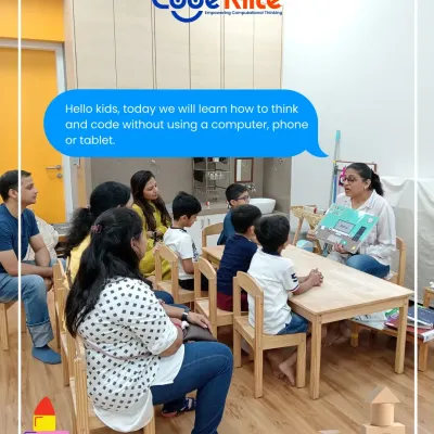 A typical start to one of my sessions. I gather the children and parents to explain that we're about to learn coding without any computers, phones, or tablets. It sets the stage for a session of pure, hands-on, brain-building fun.