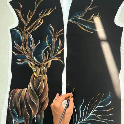 Painting this deer on a velvet tuxedo was a challenge I embraced. The design symbolizes change and new beginnings, and I used layers of metallic and earthy tones to create a galaxy-like effect on the rich, dark fabric.