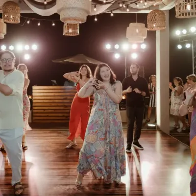 The bride's tribe takes the stage. This photo captures the energy of a group performance we choreographed for a destination wedding in Goa, where we blended different cultural music for a unique show.