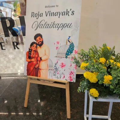 To make the welcome special, we designed this custom board featuring a lovely caricature of the parents-to-be, Roja and Vinayak. It’s these personal touches that help tell your unique family story.