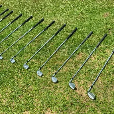 A complete set of irons ready for play. A proper fitting ensures that the length, lie, and shaft of every single iron is perfectly matched to your body and swing mechanics.