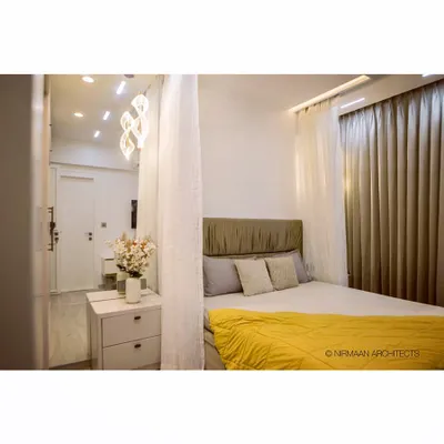 This daughter's bedroom in our Bhagwati Greens project is both smart and stylish. The canopy bed adds a touch of whimsy, while the automated lighting can be controlled for study, play, or sleep.