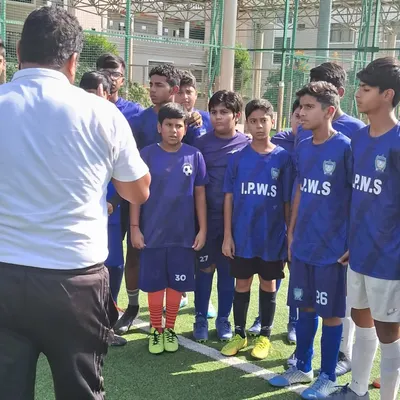 I am giving a pre-match talk to the team, discussing strategy and each player's role. Tactical understanding is as important as physical skill.