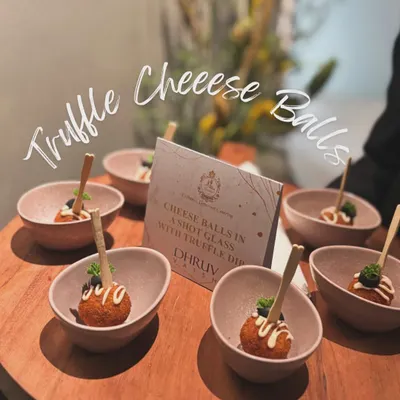 Truffle Cheese Balls served in individual bowls with a truffle dip. This was part of a bespoke menu I created for a collaboration with luxury designer Dhruv Vaish.