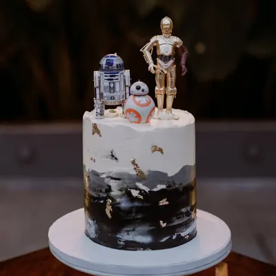 A unique, personalized wedding cake featuring Star Wars characters R2-D2, C-3PO, and BB-8. I love incorporating fun and personal details that tell your unique story as a couple.