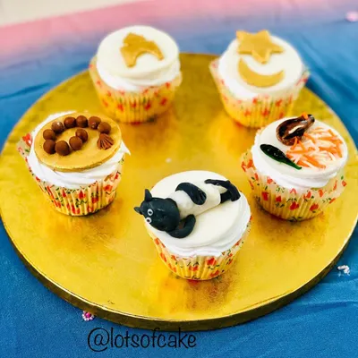 A collection of my Bakrid theme cupcakes. I had so much fun creating these custom designs, including a sheep, prayer beads, and even a mini biryani.