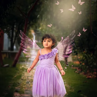 A little fairy in an enchanted wood. I use creative editing to add magical elements like glowing butterflies to make dreams a reality.