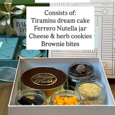 The Cousins Hamper menu. This popular Rakhi option includes a Tiramisu dream cake, Ferrero Nutella jar, cheese and herb cookies, and brownie bites.