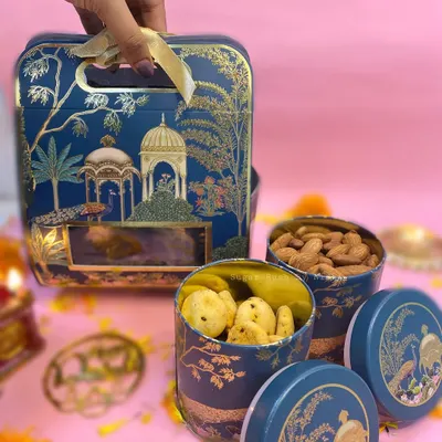 My elegant '2 Jar Box' for Diwali, featuring premium almonds and my savory Chilli Cheese Cookies. The beautiful blue and gold tin makes for a royal gift.