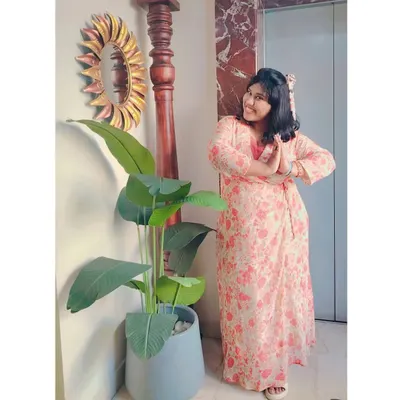 A casual pose in a lovely floral dress. Ready to welcome guests with a traditional "vanakkam".