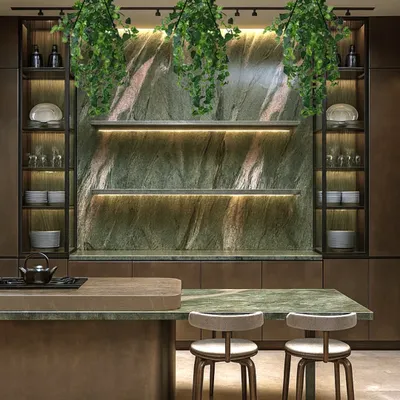This kitchen design is centered around a stunning green stone backsplash, which is beautifully illuminated by under-shelf lighting. Hanging plants and a stretch ceiling that mimics natural light make the space feel fresh and vibrant.