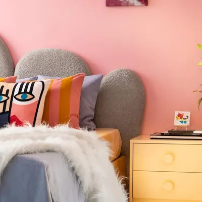 Welcome to imagination’s playground. In this room, I used a kaleidoscope of colors, a pebble-shaped headboard, and playful textures to create a space where dreams take flight and creativity knows no bounds.