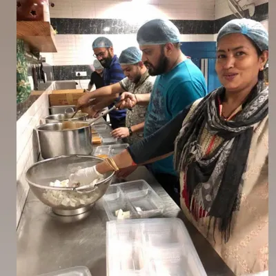 My dedicated team at work in the kitchen, carefully preparing and packing meal trays. I am proud to work alongside such a passionate group of people who help bring my culinary vision to life every day.