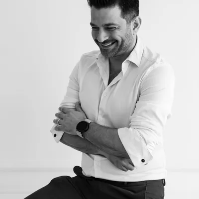 A black and white portrait. I believe a smile and a positive attitude are just as important in design as a sharp pencil.