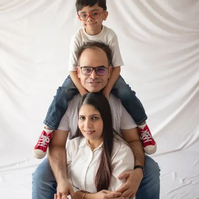 The classic family "totem pole" pose. It's always a fun and playful way to get a great family portrait with everyone close together.
