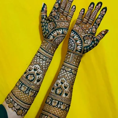 This design showcases a stunning contrast effect, where filled-in spaces make the intricate patterns pop. It features rows of elephants and elegant architectural arches for a unique look.