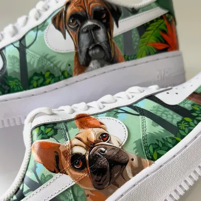 A close-up of the custom pet portraits on the Nike Air Force 1s. This shoe features a beautifully detailed painting of a French bulldog, capturing its curious and playful expression.