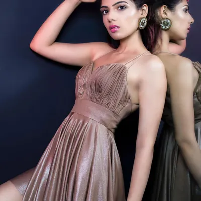 A brand shoot for Elviraa Official, featuring a golden ruched mini dress. I styled this look to feel luxurious and confident, perfect for an evening party. The mirror shot adds a dynamic and reflective element.