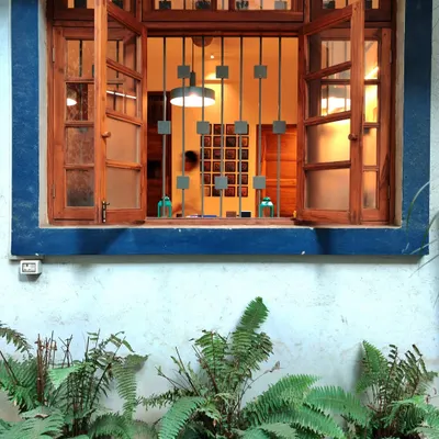 Our studio is located in a heritage bungalow in Chembur, designed over 60 years ago. We feel a deep responsibility to preserve its history, maintaining original features like the intricate grill work and timeless facade.