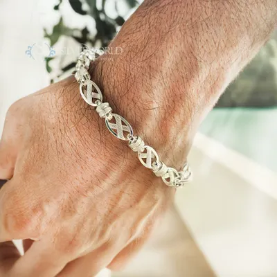 Our X-Link textured bracelet is designed for the modern man. This lifestyle shot shows how the unique sterling silver links sit comfortably on the wrist, making a statement of confidence.