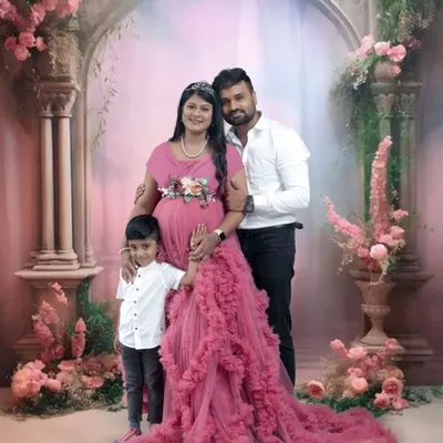 A beautiful family portrait. This couple includes their young son in their maternity shoot, capturing the excitement of him becoming a big brother.