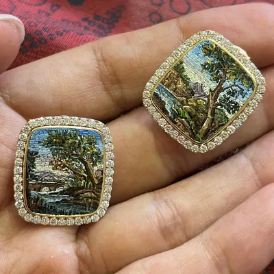 A closer, in-hand look at the "Chapter of the Forest" earrings. You can see the tiny, individual pieces that make up the landscape, a testament to the slow, meditative process of micromosaic.