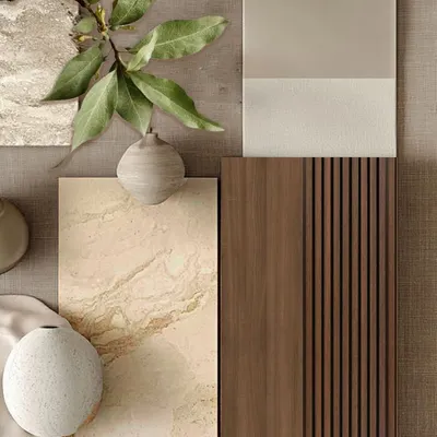 A refined play of textures and tones. This material board captures the calm, grounded essence of our design philosophy, featuring natural stone, warm wood finishes, and soft fabric swatches that reflect our commitment to timeless, earthy elegance.