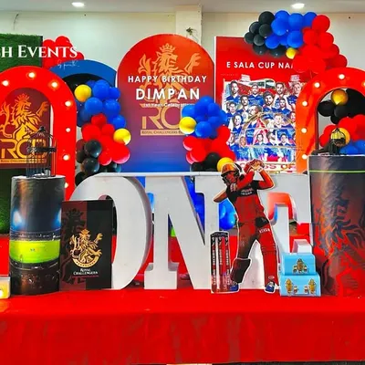 Ee Sala Cup Namde! A full-throttle RCB cricket theme for Dimpan's first birthday, featuring player cutouts, team colors, and a bold 'ONE' display. This entire setup was planned and executed in just one day.