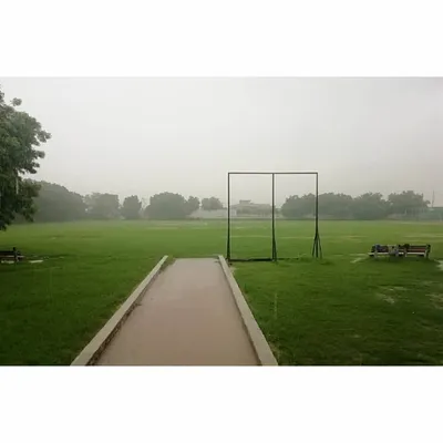 A view of our lush green cricket ground. We believe that training on professional-quality grounds is essential for preparing players for real matches.