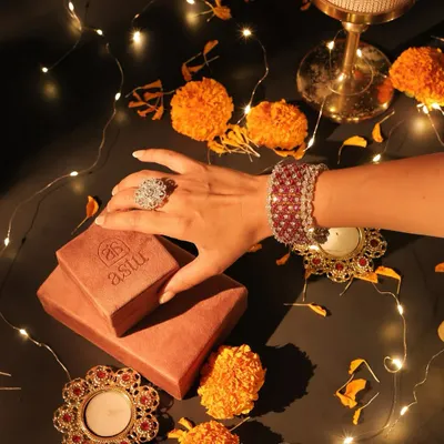 A festive flatlay capturing the spirit of Diwali. My statement rings and bracelets are crafted to make your celebratory moments unforgettable and sparkle as brightly as you do.