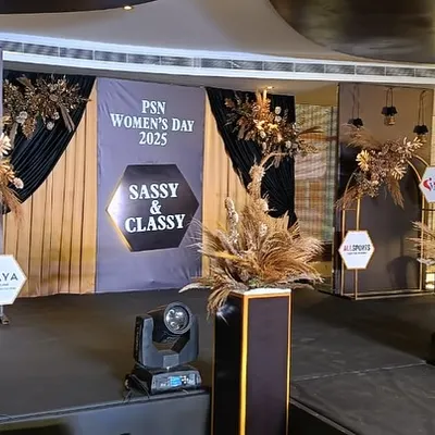 The stage design for the PSN Women's Day 2025 event. We used a modern, layered backdrop with brand logos, boho-chic dried floral arrangements, and spotlights to create a stylish focal point.