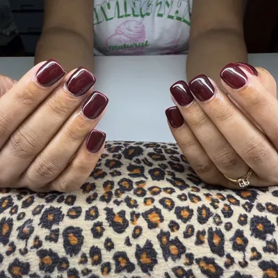 A classic and beautiful solid maroon gel polish manicure. This color is timeless and looks gorgeous on this short, square nail shape.