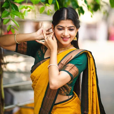 Modeling a beautiful yellow 'Manjal' cotton saree. The hand gestures of Bharatanatyam lend a unique grace to ethnic wear photoshoots.