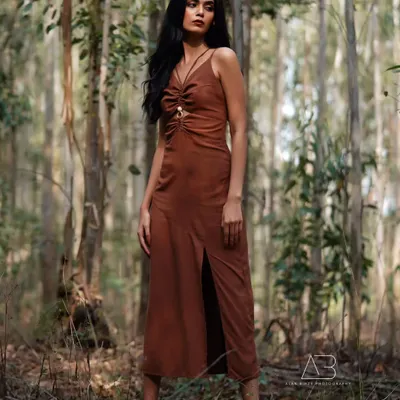 I love shooting outdoors where the environment becomes part of the story. This shot, taken deep in a forest, uses natural light and shadow to create a feeling of quiet intensity and connection with nature for this western wear lookbook.