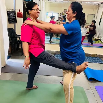 A beautiful moment of connection and support between two students in my class. Partner stretches like this help improve balance and flexibility while fostering a sense of community.