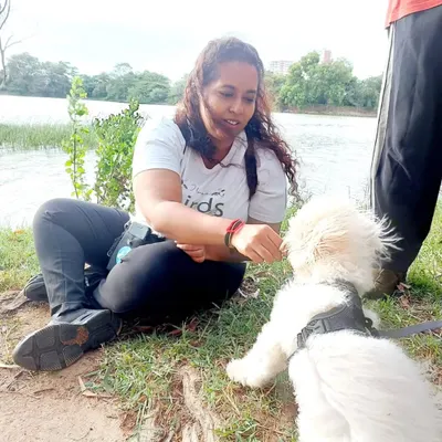 This is me with Ginger, a sweet boy who was once very nervous. Through patient training and positive experiences like our nature walks, he learned to trust and explore, eventually graduating with flying colors.