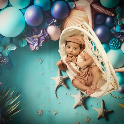 Mr. Handsome is exploring under the sea! This fantasy theme with starfish and bubbles is so creative and makes for a truly unique newborn portrait.