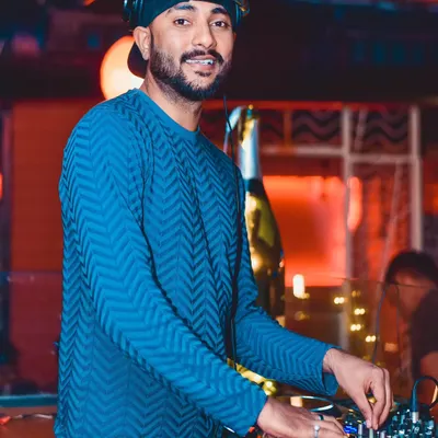 In the zone, mixing tracks under the club lights. This is where I experiment with different genres, blending sounds to create a unique atmosphere. Whether it's deep house or progressive techno, the focus is always on the flow.