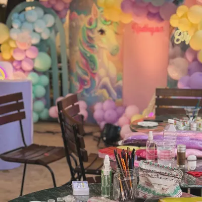 Our setup at a unicorn-themed birthday party. We come prepared with a full range of professional, skin-safe paints and brushes for any theme.