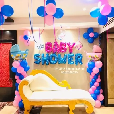 For this baby shower, I provided a complete setup including a special queen chair for the mom-to-be. The backdrop features "Baby Shower" foil balloons, balloon pillars, and themed baby carriage foil balloons in pink and blue.