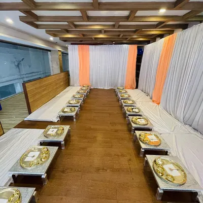 An overview of my Royal Thali seating arrangement. The low chowki tables and individual thalis create an intimate and traditional dining setting, perfect for special family gatherings or pre-wedding functions.