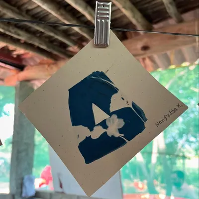 A cyanotype print created by a child during our outreach day with the Garike initiative in Kolar district. The children used found objects and their own hands to make art.