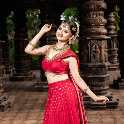 A breathtaking look featuring a traditional red half-saree paired with my classic temple jewellery. This shows how you can achieve a divine, traditional look even without a full saree.