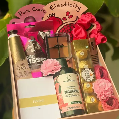 A hamper that's perfect for pampering your sister or best friend. This box is filled with beauty essentials, including Nykaa eyeshadow, a Zara mini perfume, Body Shop shower gel, and Ferrero Rocher.