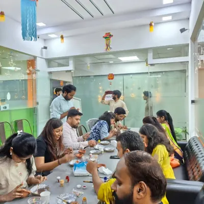Here is a wide view of a corporate Diwali workshop in full swing. I set up everything your team needs to start creating, right in the comfort of your office space.