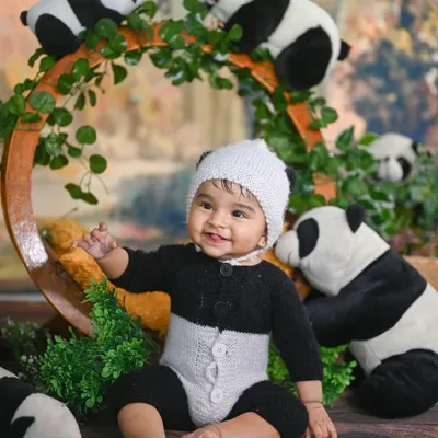 One of my most popular themes is this adorable panda shoot! This little one is having a great time sitting amongst his fluffy panda friends.