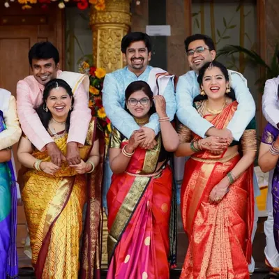 Capturing the entire extended family in one happy, candid shot is a specialty of ours. This photo from a family gathering is full of laughter and connection.